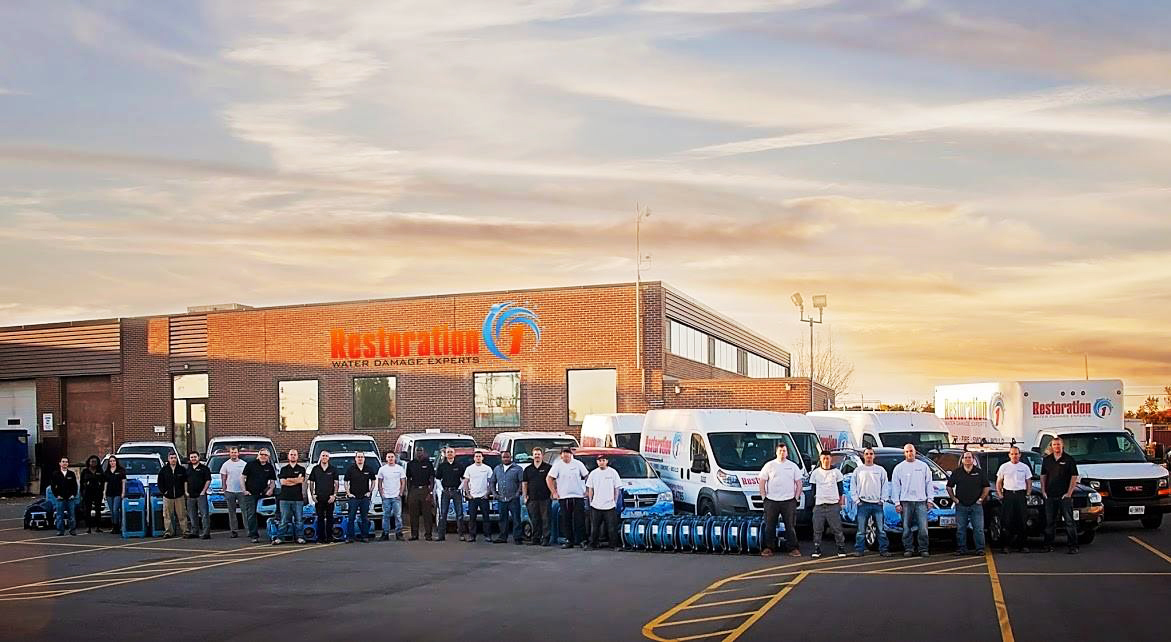 DO NOT USE | Morris County Team of Restoration 1 franchisees standing in front of their building
